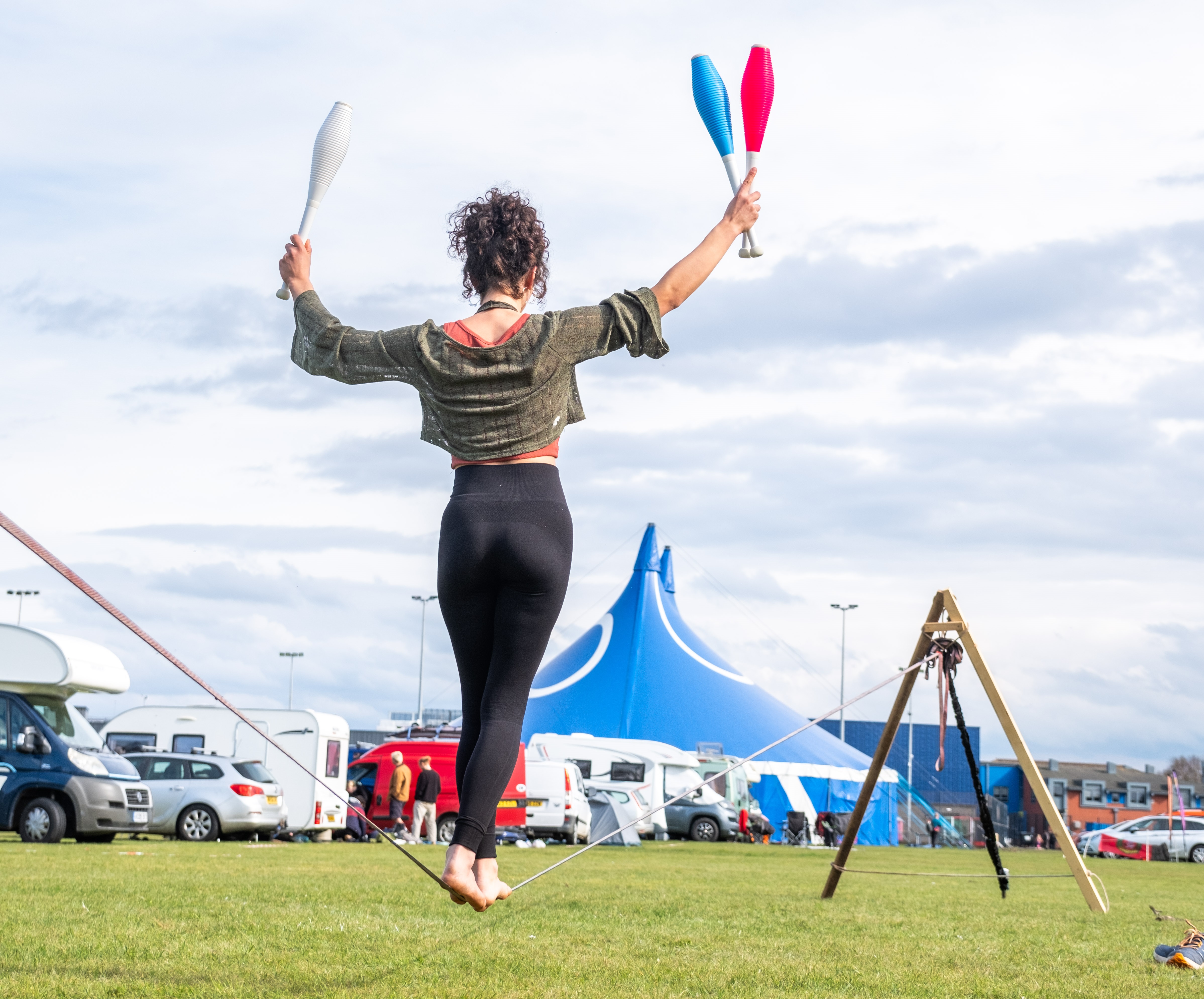 A photo of people slacklining at BJC 2024