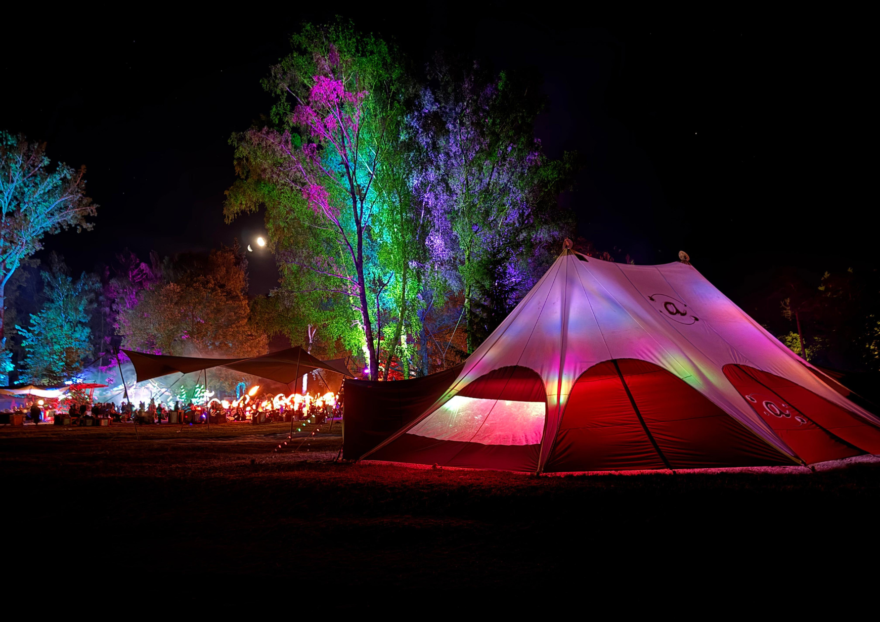 A photo of the Spinning@ tent at night